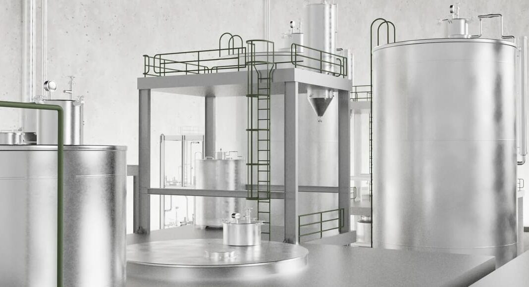 Industrial processing plant with large stainless steel tanks, platforms, and a laddered catwalk