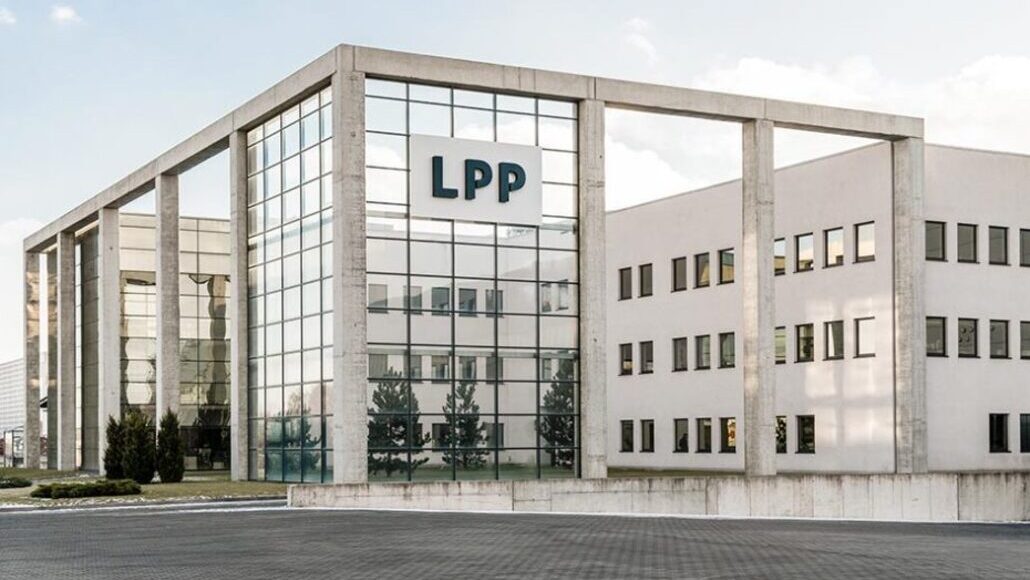 Modern office building with a glass-front atrium and the letters LPP on the facade