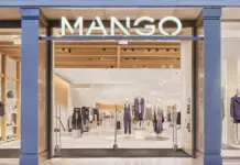 Mango Targets Italy Growth With 22 New Coin Store Openings Mango storefront with mannequins in stylish outfits inside a bright, modern shop.