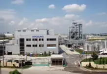 Hyosung Increases Personal Hygiene Spandex Capacity with Brazil Expansion Industrial complex with a Hyosung facility, large building and processing tanks in a chemical plant yard.