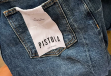 Pistola Denim Implements Inspectorio Technology to Enhance Apparel Production Back pocket of blue jeans with a white tag reading 'PISTOLA' and 'LOS ANGELES'
