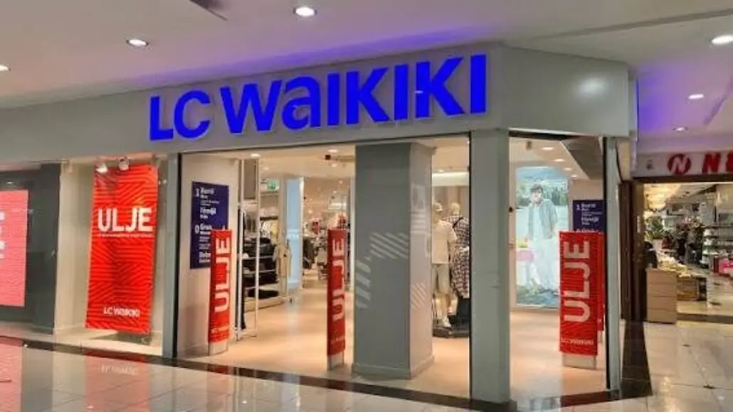 LC Waikiki storefront in a mall with a bright blue sign and open entrance, mannequins and clothing visible inside.