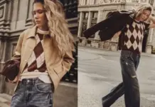 Inditex Brings Lefties to UK as Value Fashion Battle Intensifies Young woman in argyle sweater and jeans poses near a building, wearing a tan jacket draped over her shoulders.