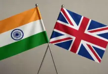 New UKFT Member Guide Helps UK Fashion and Textile Businesses Navigate The Indian Market Two flags, Indian and British, crossed on stands against a neutral background.