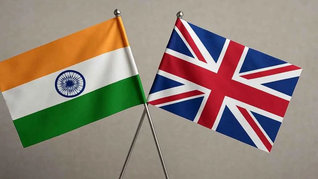 Two flags, Indian and British, crossed on stands against a neutral background.