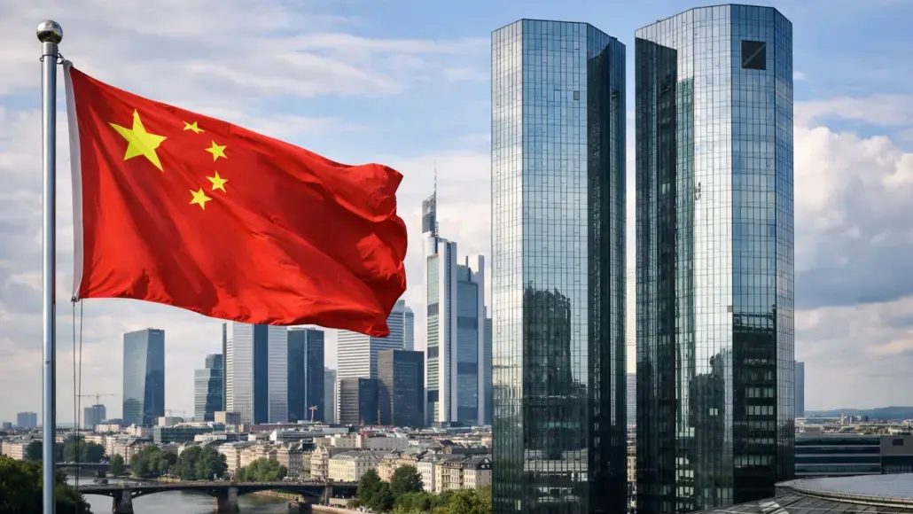 Chinese flag waving on a pole with a modern glass skyscrapers in the city skyline