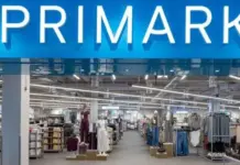 Primark Signs Multiyear Recycled Polyester Deal with Circ for 2029 Launch Primark store entrance with bright blue sign and well-lit clothing aisles inside.