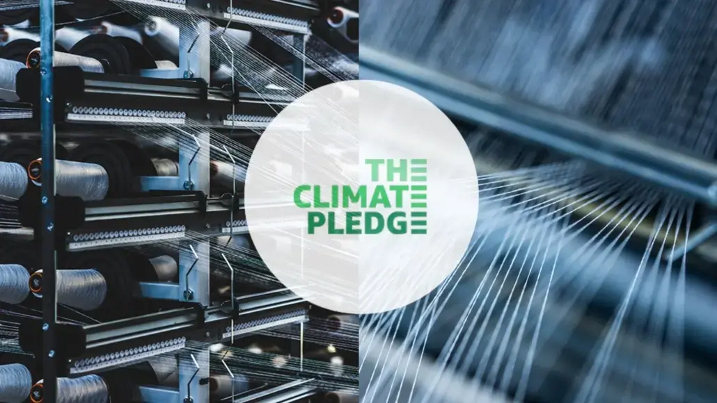 Industrial machinery on the left and blue fiber cables on the right, with a white circle in the center reading The Climate Pledge.