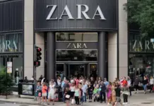 Zara Drives Nearly 70% of Inditex Total Revenue in H1 2026 Crowd of shoppers standing outside a Zara store on a city street.